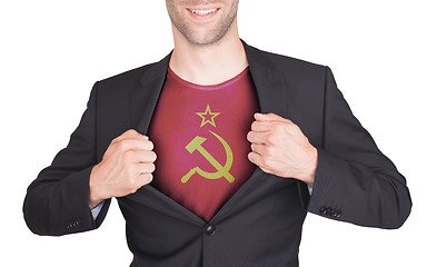 Image showing Businessman opening suit to reveal shirt with flag