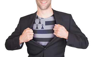 Image showing Businessman opening suit to reveal shirt with flag