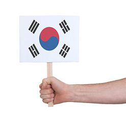 Image showing Hand holding small card - Flag of South Korea