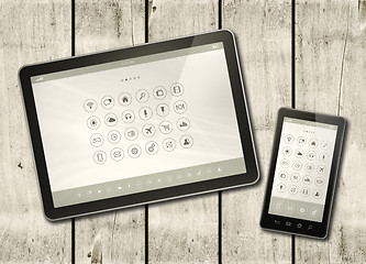 Image showing Smartphone and digital tablet PC with desktop icons on a white w