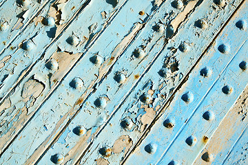 Image showing dirty stripped paint in the blu nail