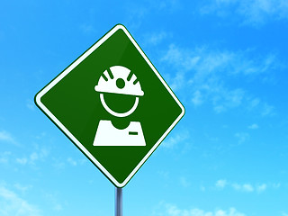 Image showing Manufacuring concept: Factory Worker on road sign background