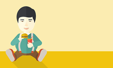 Image showing Man eating hamburger. 