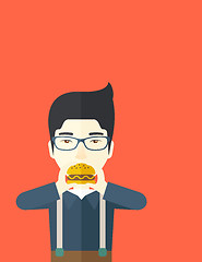 Image showing Man eating hamburger. 