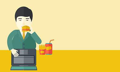 Image showing Man eating hamburger. 