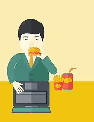 Image showing Man eating hamburger. 