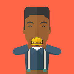 Image showing Man eating hamburger. 