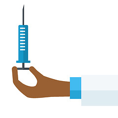 Image showing Hand holding syringe.