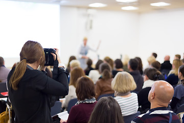 Image showing Television broadcasted press conference.