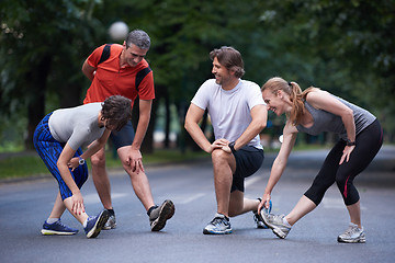 Image showing jogging people group stretching