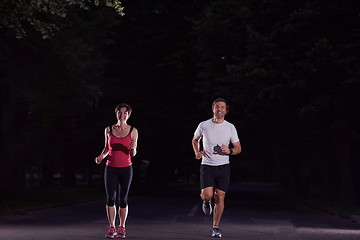 Image showing couple jogging at early morning