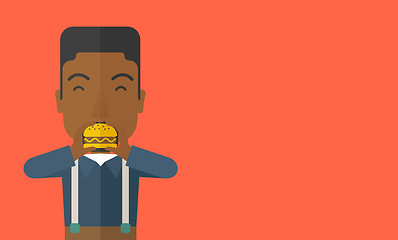 Image showing Man eating hamburger. 