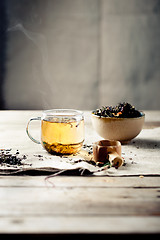 Image showing Green tea in a glass cup with steam