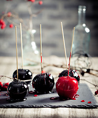 Image showing Halloween black and red caramelized apples