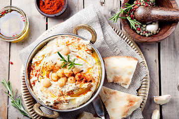 Image showing Hummus, chickpea dip, with rosemary, paprika