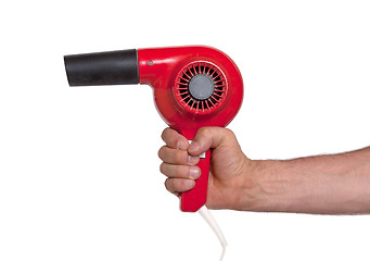 Image showing Old red hairdryer in hand