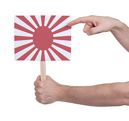 Image showing Hand holding small card - Flag of Japan