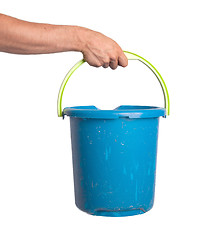 Image showing Human hand holding empty plastic pail