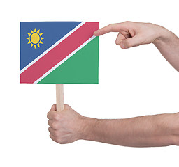 Image showing Hand holding small card - Flag of Namibia