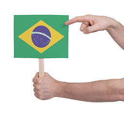 Image showing Hand holding small card - Flag of Brazil