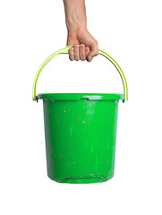 Image showing Human hand holding empty plastic pail