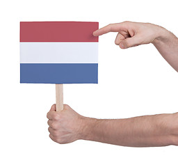 Image showing Hand holding small card - Flag of the Netherlands