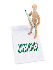 Image showing Wooden mannequin writing - Questions
