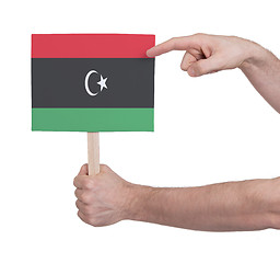 Image showing Hand holding small card - Flag of Libya