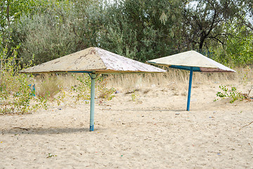 Image showing Old metal beach umbrellas on the beach
