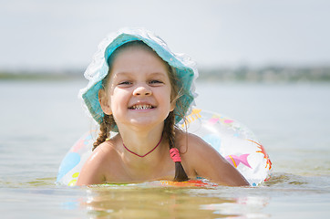 Image showing Four-year girl bathes in the river