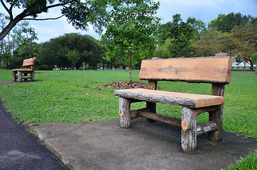 Image showing Wood bench in a green garden