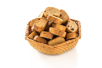 Image showing Rusks with raisins in a wicker basket.