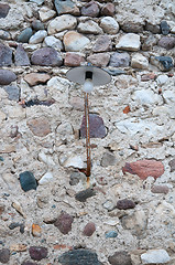 Image showing Old street lamp attached to a brick wall