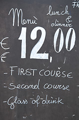 Image showing A restaurant menu that indicates lunch at a fixed price of twelv