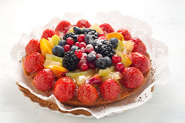 Image showing Cake with lots of fresh fruit : strawberries , kiwi , melon , be