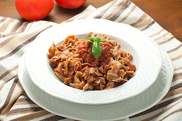 Image showing 
Homemade pasta topped with tomato and Parmesan integral