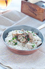 Image showing 
Pasta and rice with porcini mushrooms served with butter and pa