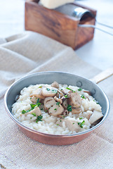 Image showing 
Pasta and rice with porcini mushrooms served with butter and pa