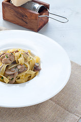 Image showing 
Pasta and rice with porcini mushrooms served with butter and pa