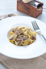 Image showing 
Pasta and rice with porcini mushrooms served with butter and pa