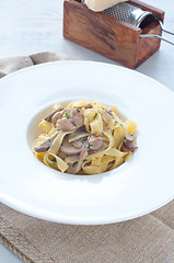 Image showing 
Pasta and rice with porcini mushrooms served with butter and pa