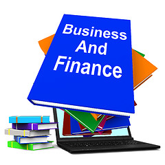 Image showing Business And Finance Book Stack Laptop Shows Businesses Finances