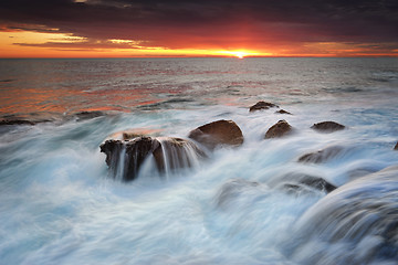 Image showing OceanwWaterfalls over rocks