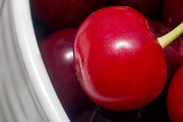 Image showing Big ripe cherry in a ceramic vase.