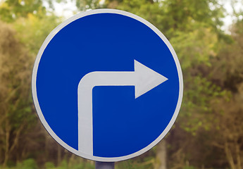 Image showing Road sign on the highway indicating the turn.