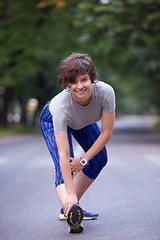 Image showing woman  stretching before morning jogging