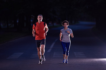 Image showing couple jogging at early morning