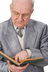 Image showing Senior reading a book