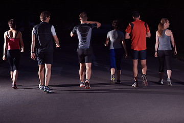 Image showing people group jogging at night