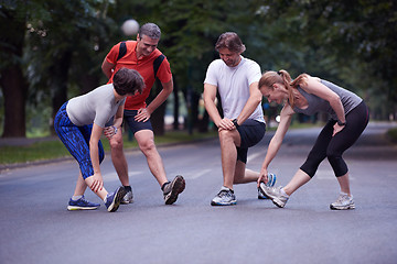 Image showing jogging people group stretching